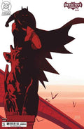 Comic book cover featuring a silhouette of a character with a red cape and helmet, standing on a building.