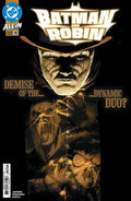 Comic book cover featuring Batman and Robin with a dark background and glowing text.