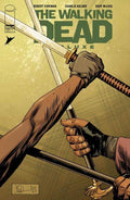 Comic book cover of 'The Walking Dead Luxe' with hands holding a sword.
