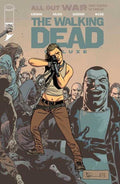 Comic book cover of 'The Walking Dead' featuring a character holding a gun amidst zombies and other characters.