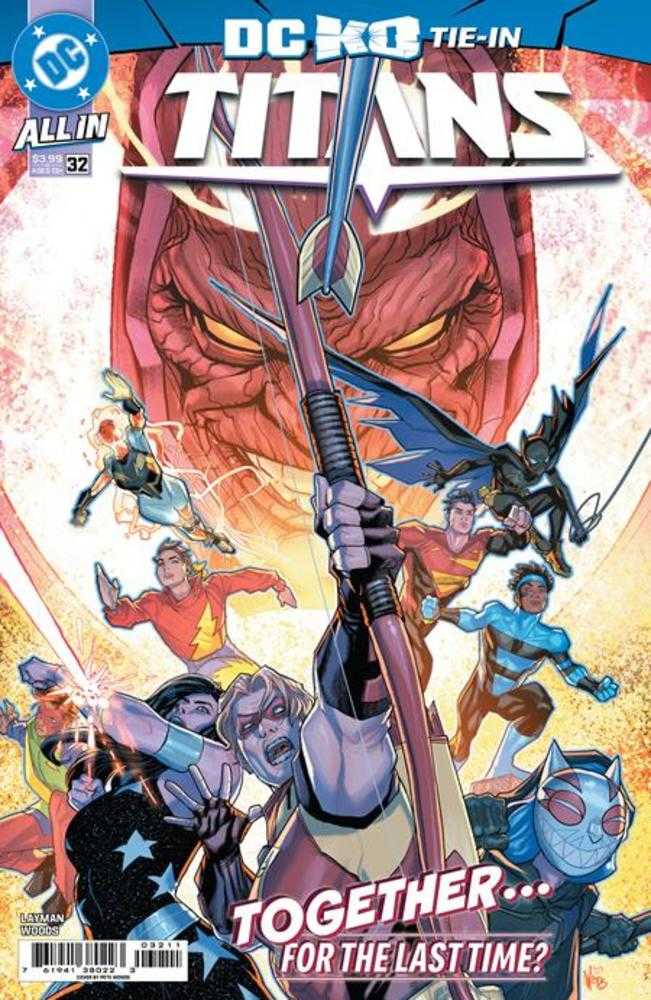 Comic book cover featuring superhero characters with a large weapon, DC Comics logo visible