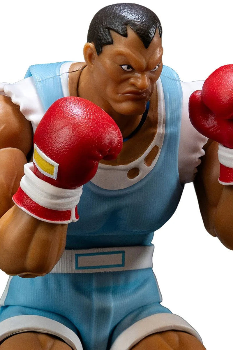 Boxing figure in blue shorts and red gloves on a white background