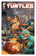 Comic book cover featuring Teenage Mutant Ninja Turtles with a pumpkin and robot in a dark alley.