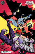 Comic book cover featuring Batman and Robin in action against a dynamic background.