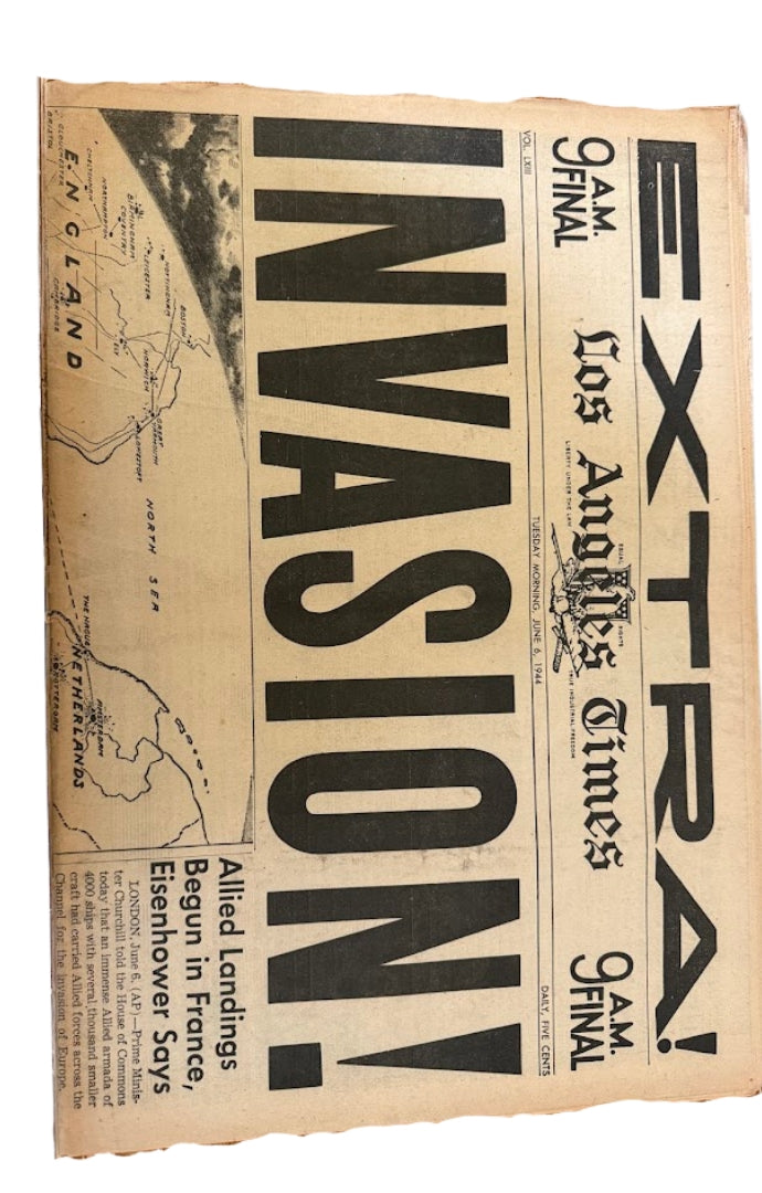 Vintage newspaper with 'INVASION!' headline and map of England.