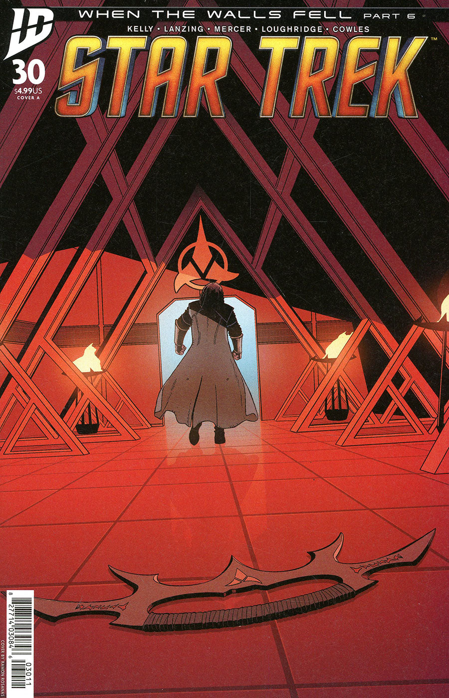 Comic book cover of 'Star Trek' with a character standing in front of a geometric design.