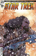 Comic book cover of 'Star Trek' with a character in a snowy landscape