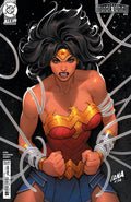 Comic book cover featuring Wonder Woman with a black background and superhero emblem.