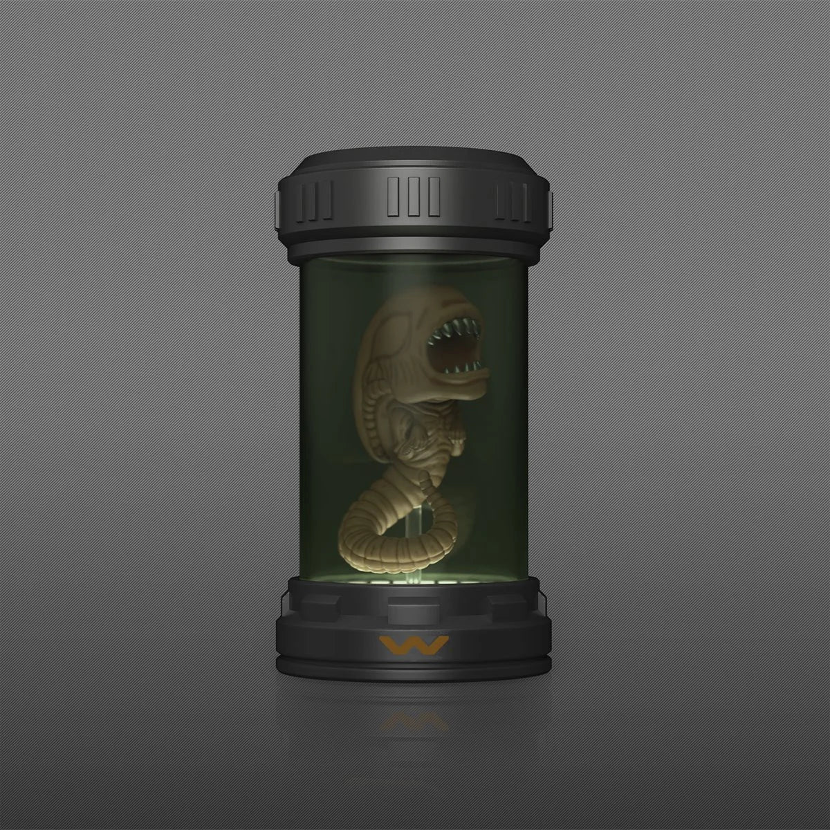 A sci-fi collectible display featuring a detailed Xenomorph figure preserved inside a glowing green glass vial, housed in a black cylindrical capsule on a dark gray background.